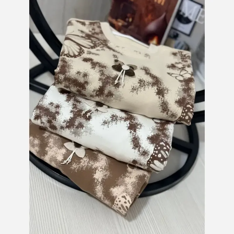 ست بلوز شلوار دخترانه دورس لاکرا طرح پروانه رنگ کرم سفید شکلاتی سایز 45 تا 65 - تصویر 7